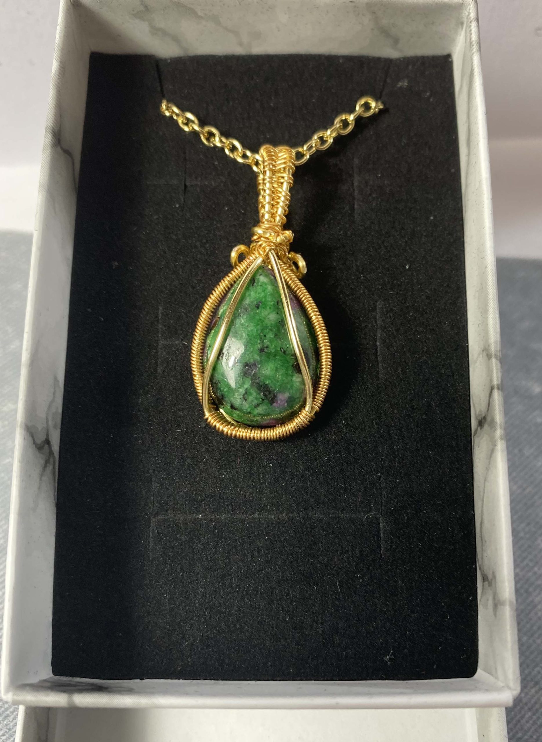 Gorgeous small ruby in zoisite wire-wrapped pendant
