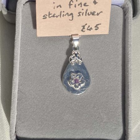 Delicate fine and sterling silver pendant with alexandrite stone