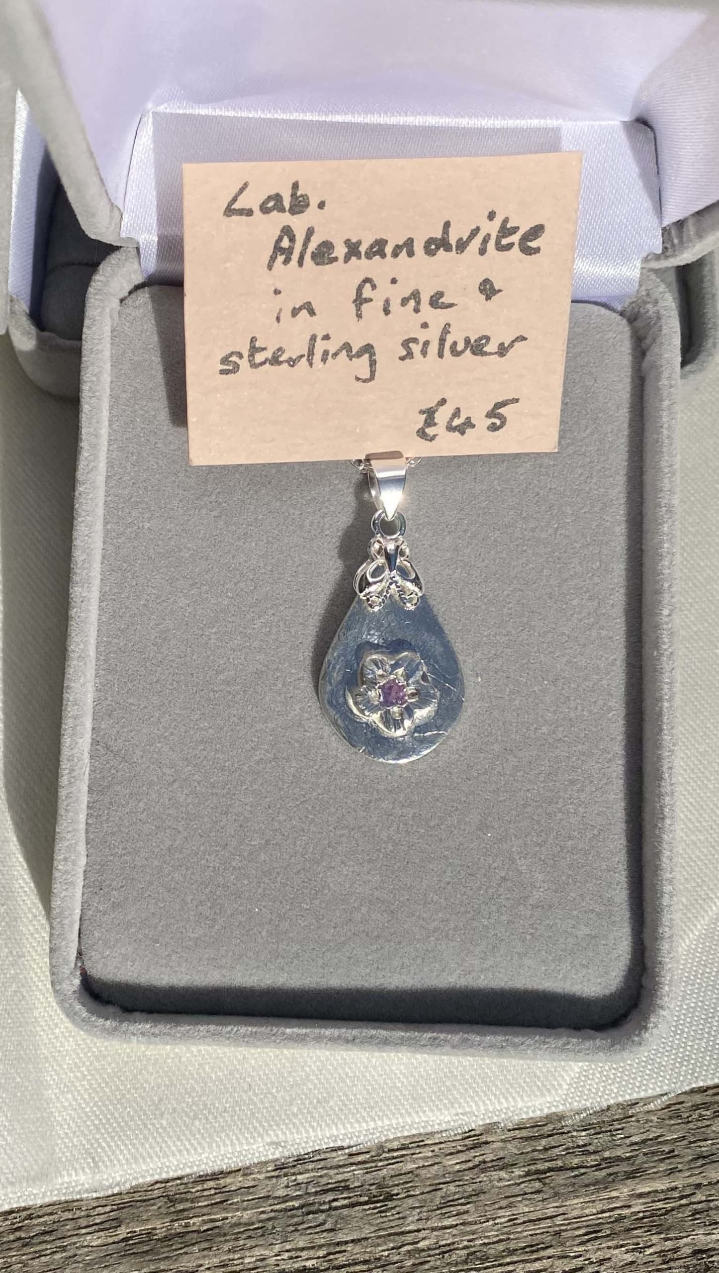 Delicate fine and sterling silver pendant with alexandrite stone