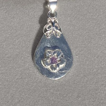 Delicate fine and sterling silver pendant with alexandrite stone
