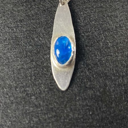 Delicate sterling silver pendant with stunning neon apatite