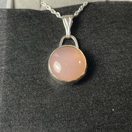 Elegant sterling silver pendant with pink chalcedony cabochon