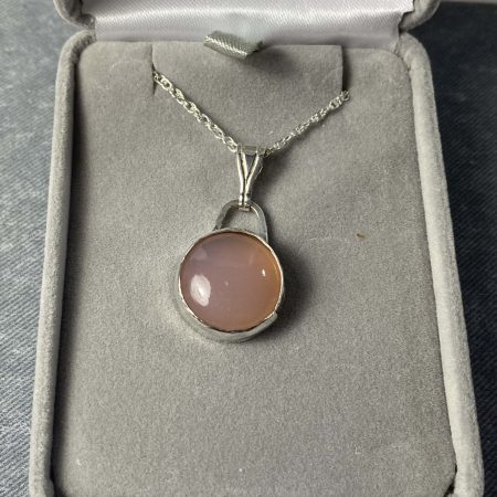 Elegant sterling silver pendant with pink chalcedony cabochon