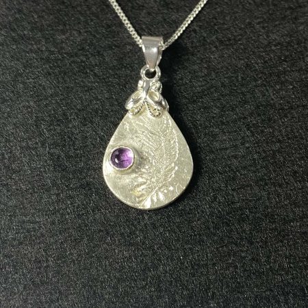 Delicate fine and sterling silver pendant set with amethyst