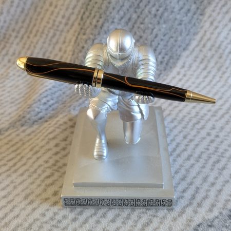 Euro twist acrylic ballpoint pen in black with burnt orange coloured lines