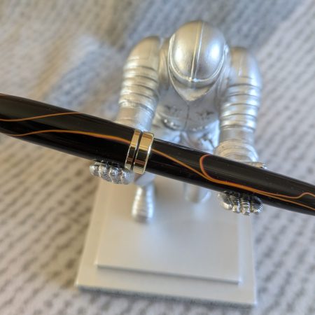 Euro twist acrylic ballpoint pen in black with burnt orange coloured lines