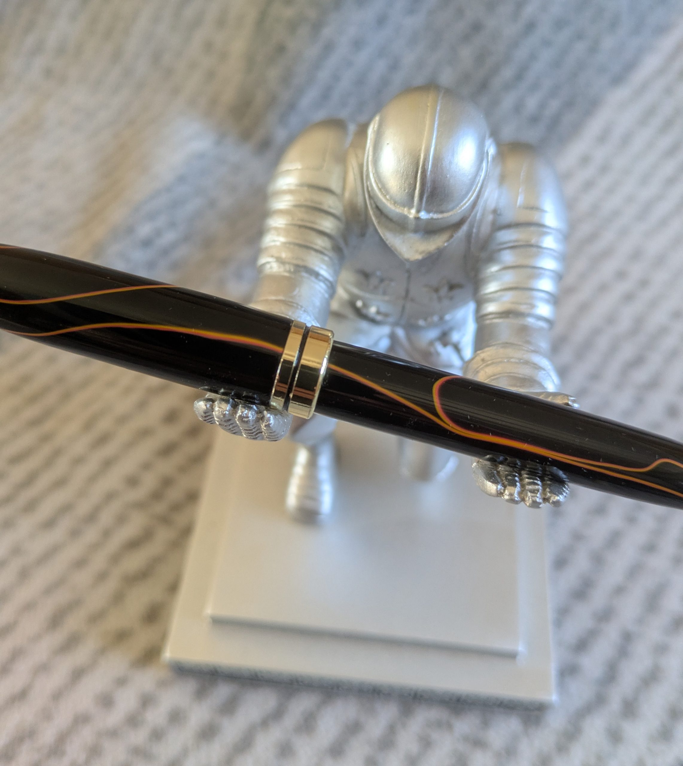 Euro twist acrylic ballpoint pen in black with burnt orange coloured lines