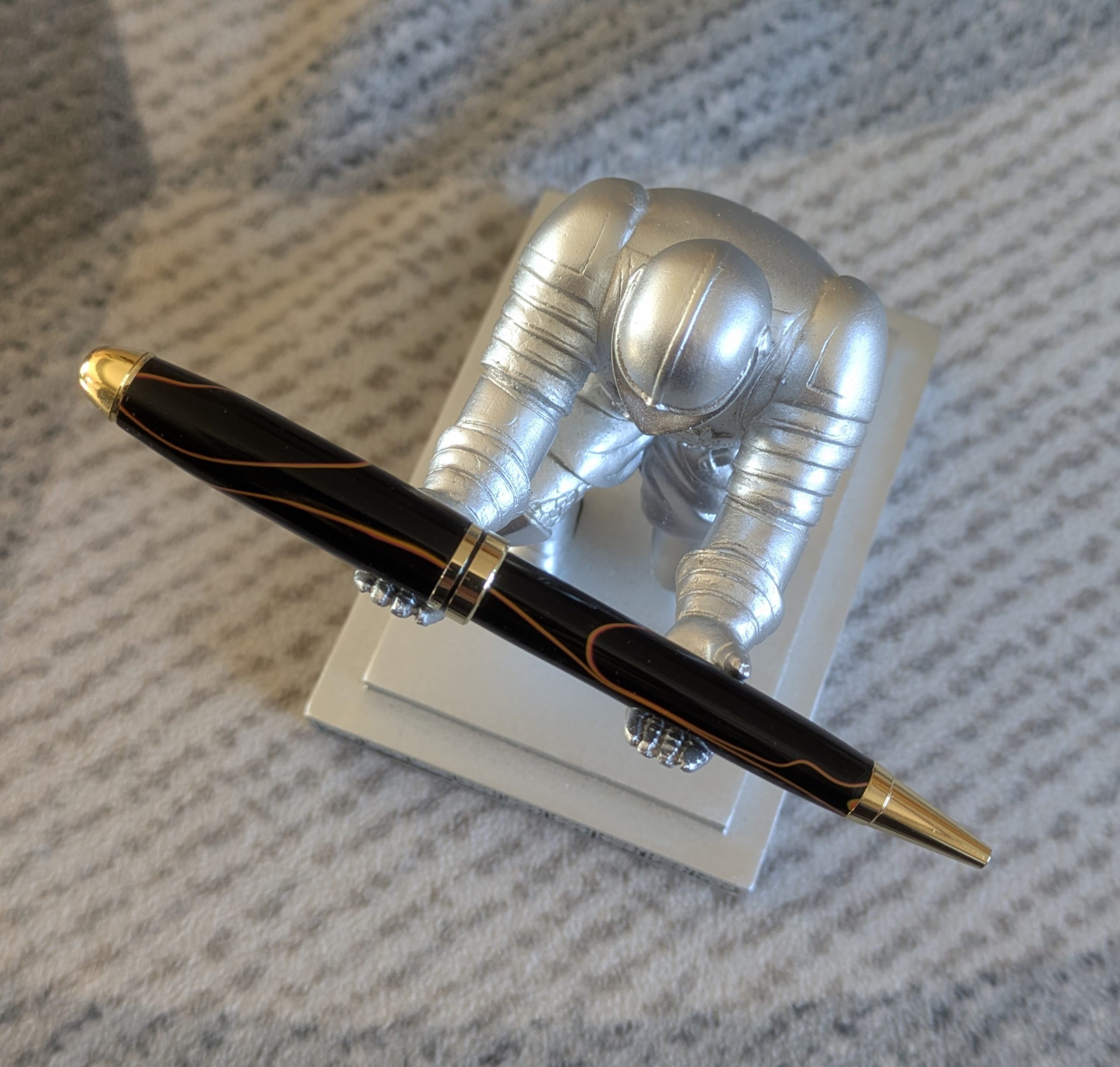 Euro twist acrylic ballpoint pen in black with burnt orange coloured lines