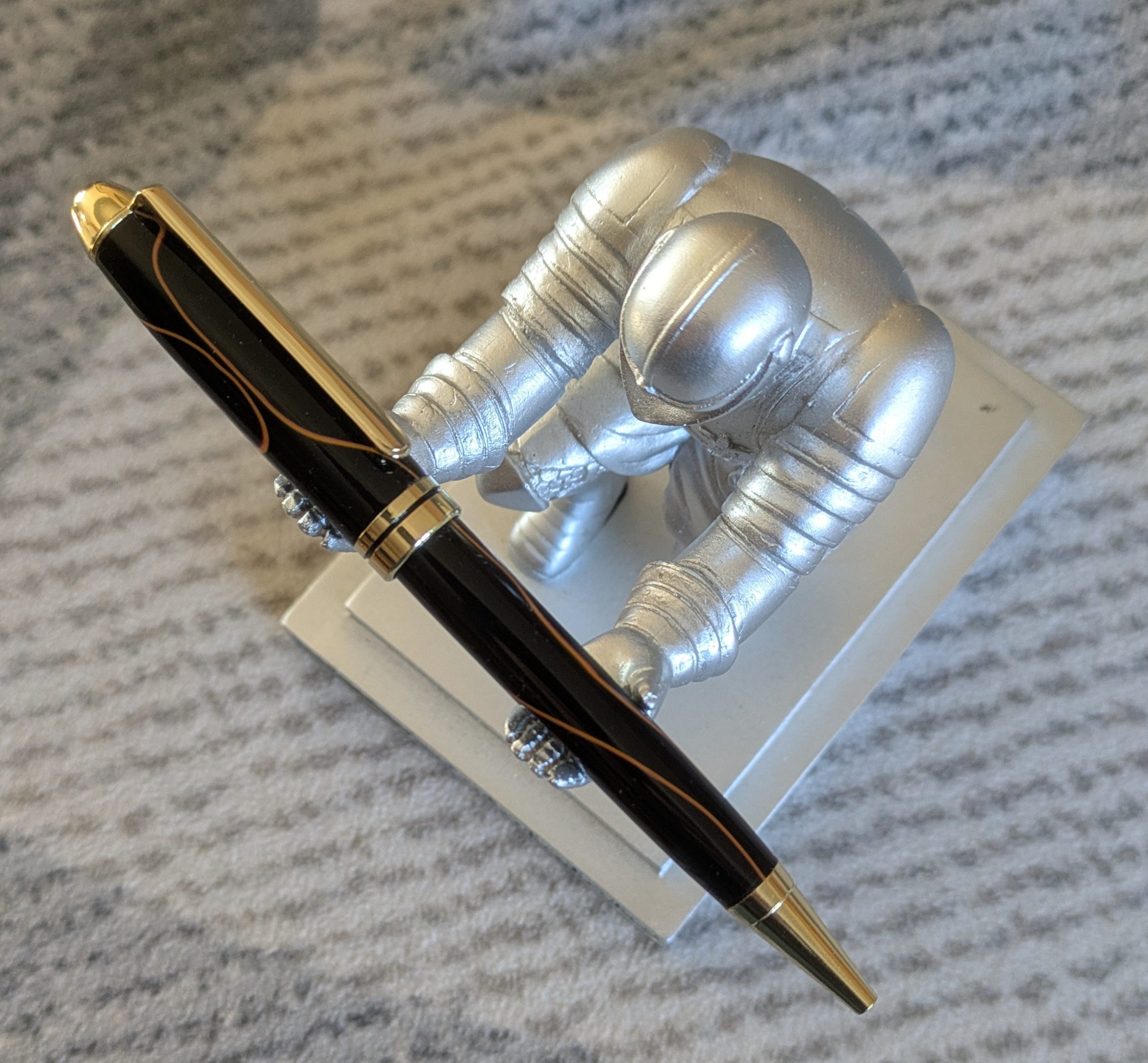 Euro twist acrylic ballpoint pen in black with burnt orange coloured lines