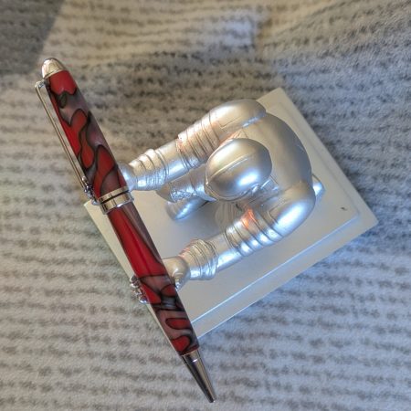 Euro twist ballpoint pen made from red acrylic with pearled coloured swirls