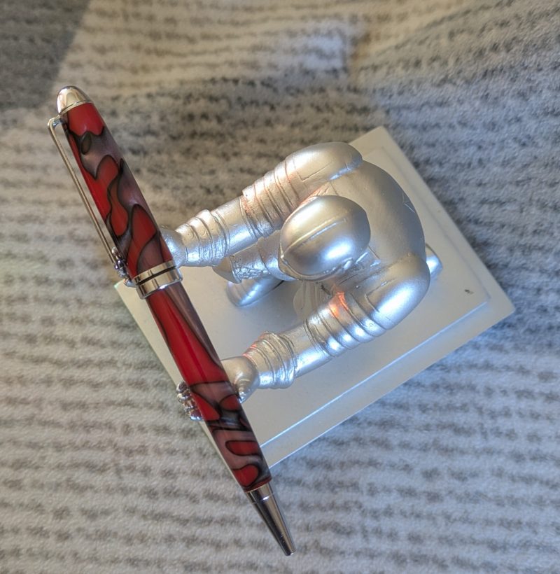Euro twist ballpoint pen made from red acrylic with pearled coloured swirls