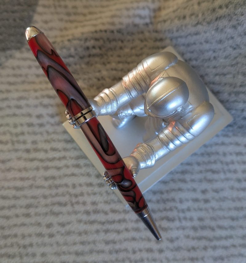 Euro twist ballpoint pen made from red acrylic with pearled coloured swirls
