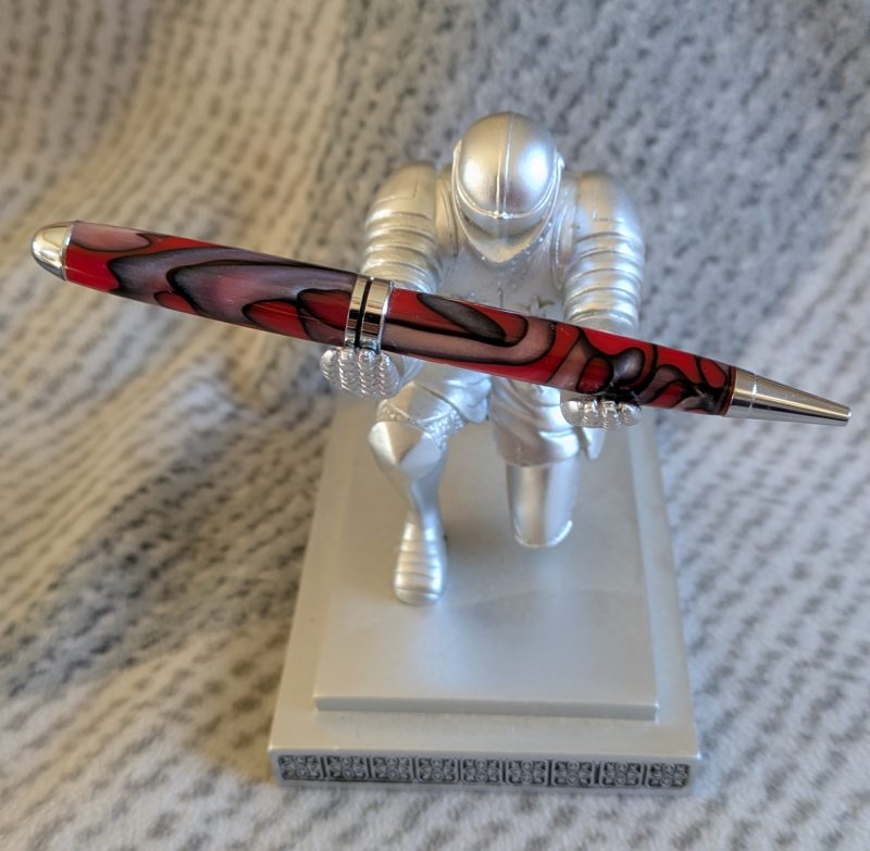 Euro twist ballpoint pen made from red acrylic with pearled coloured swirls