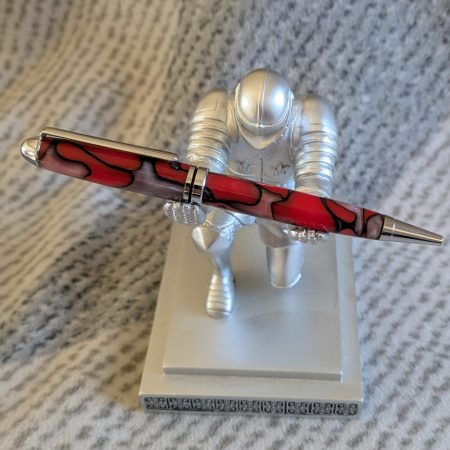 Euro twist ballpoint pen made from red acrylic with pearled coloured swirls