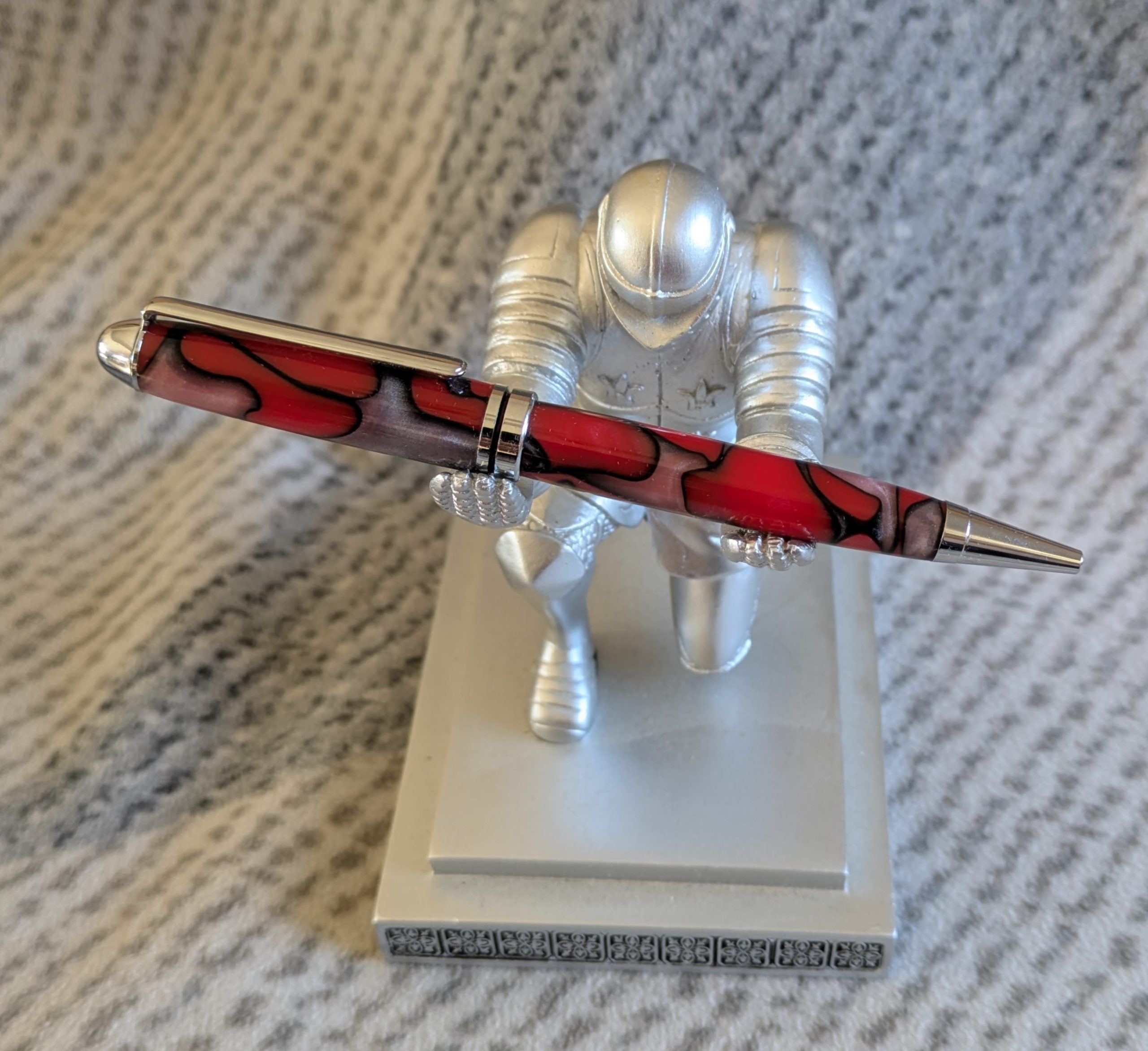 Euro twist ballpoint pen made from red acrylic with pearled coloured swirls
