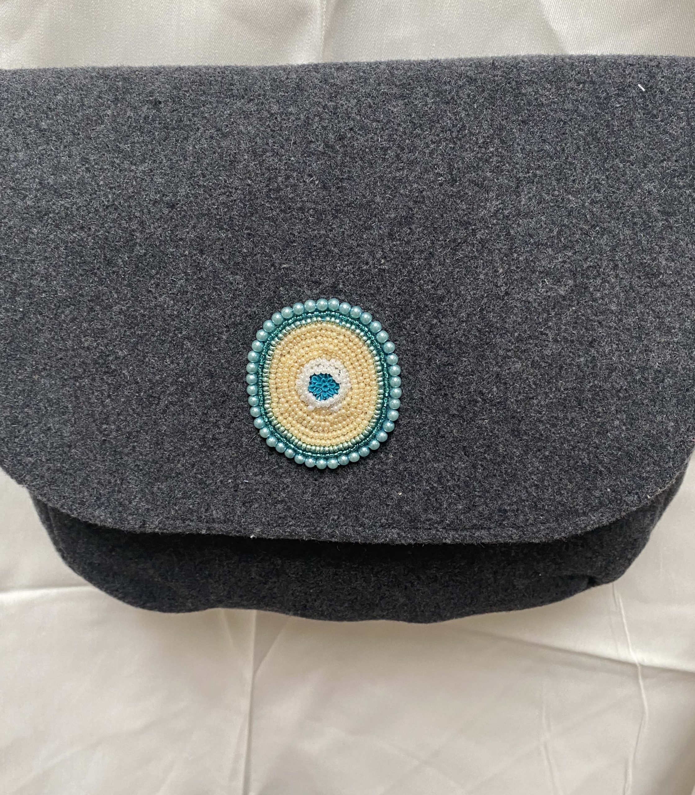Handmade shoulder bag, pure wool with hand beaded motif on flap