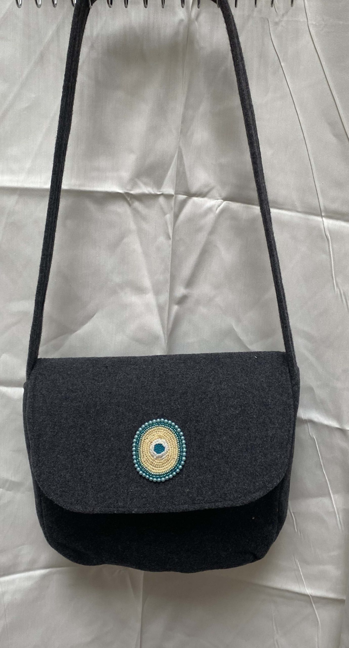 Handmade shoulder bag, pure wool with hand beaded motif on flap