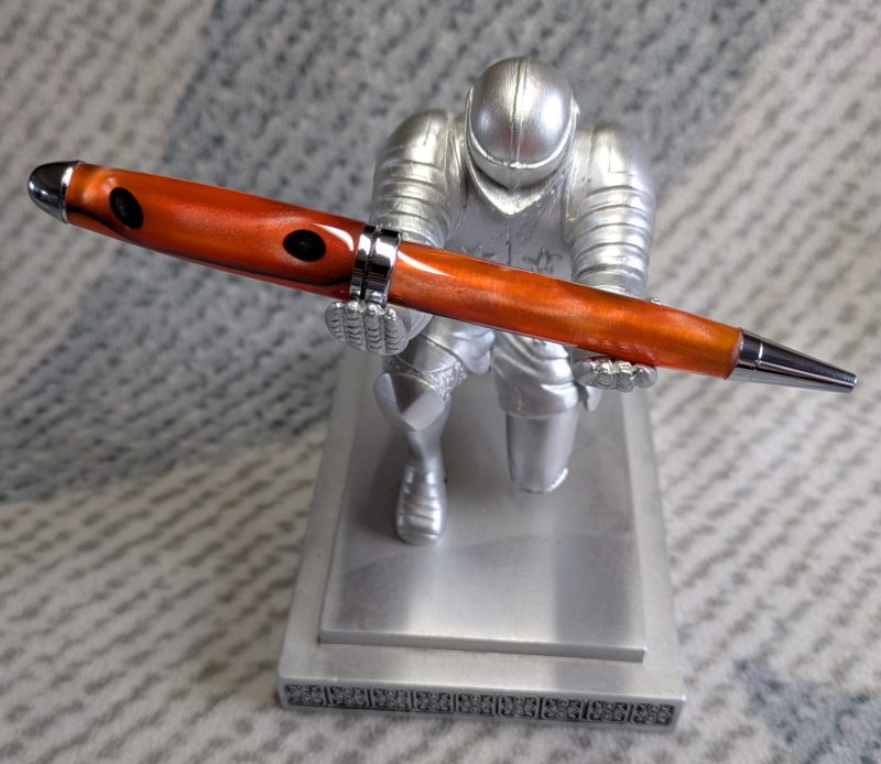 Euro twist ballpoint pen in orange acrylic with black lines and chrome fittings