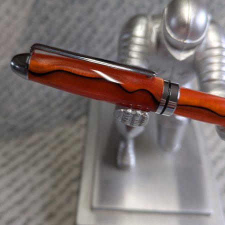 Euro twist ballpoint pen in orange acrylic with black lines and chrome fittings