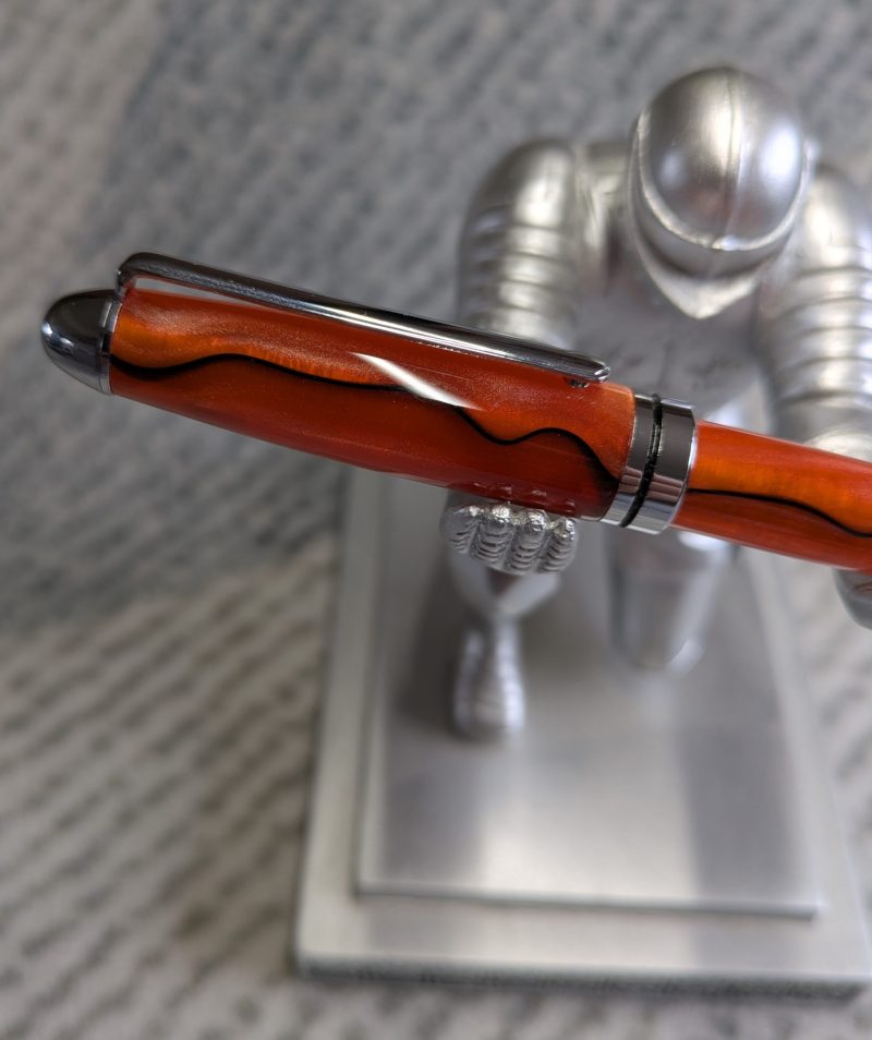 Euro twist ballpoint pen in orange acrylic with black lines and chrome fittings