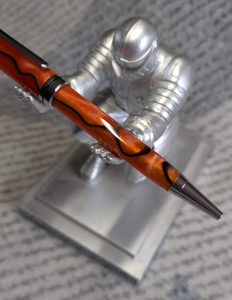 Euro twist ballpoint pen in orange acrylic with black lines and chrome fittings