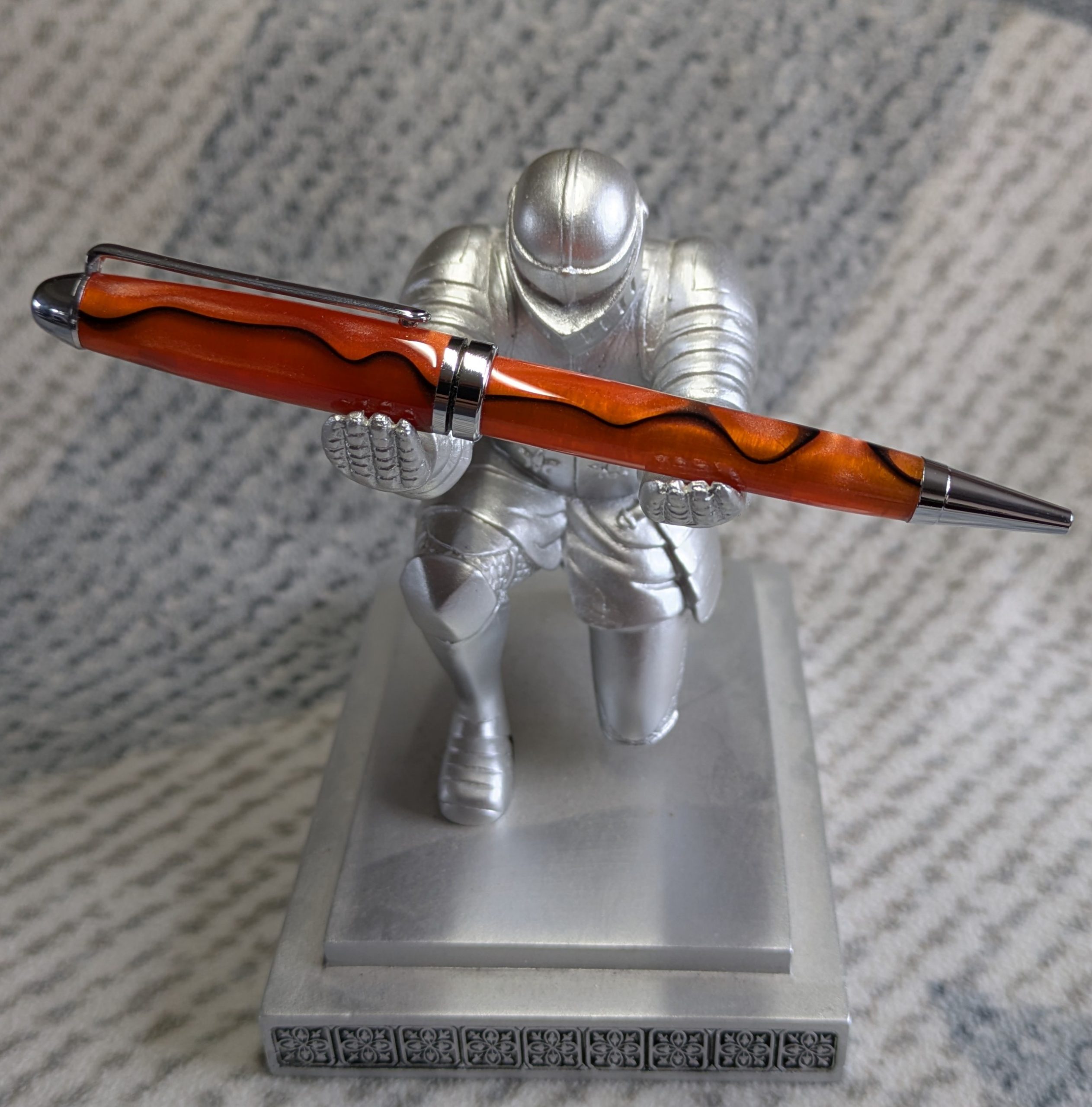 Euro twist ballpoint pen in orange acrylic with black lines and chrome fittings