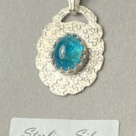 Stunning sterling silver pendant set with beautiful neon apatite