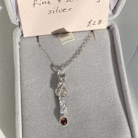 Delicate, elegant fine and sterling silver pendant set with rhodonite garnet