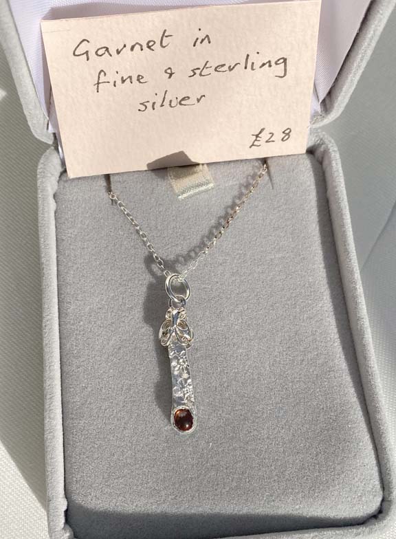 Delicate, elegant fine and sterling silver pendant set with rhodonite garnet