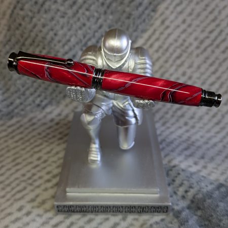 Acrylic omega-style Rollerball Pen Made from red acrylic; with black and white lines