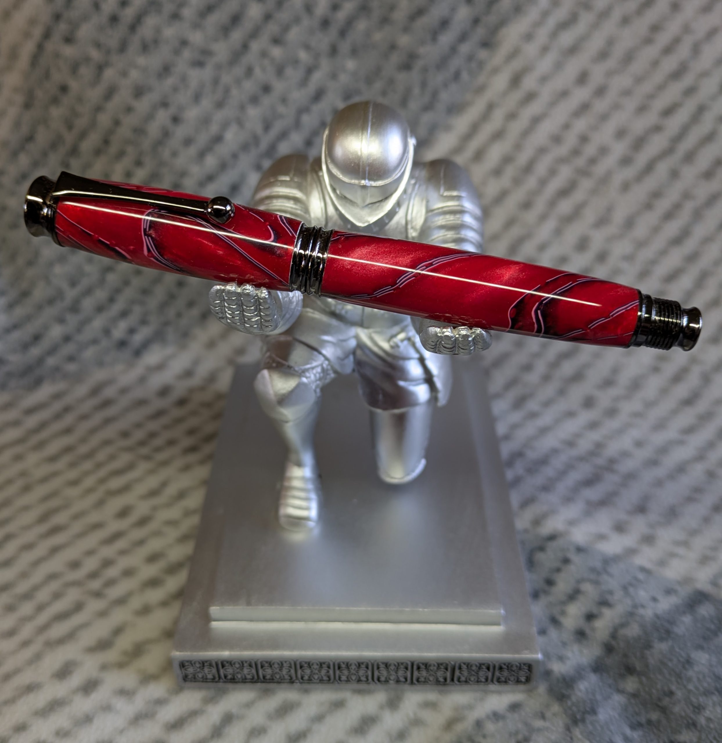 Acrylic omega style Rollerball Pen Made from red acrylic; with black and white lines