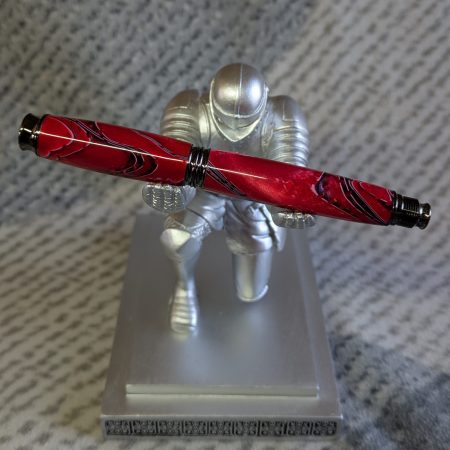Acrylic omega style Rollerball Pen Made from red acrylic; with black and white lines