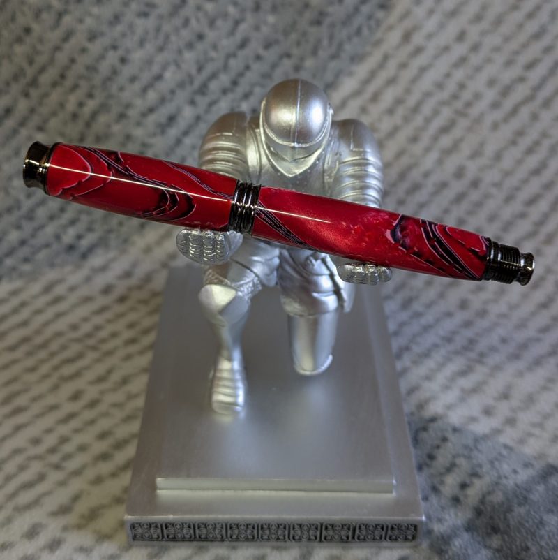 Acrylic omega style Rollerball Pen Made from red acrylic; with black and white lines
