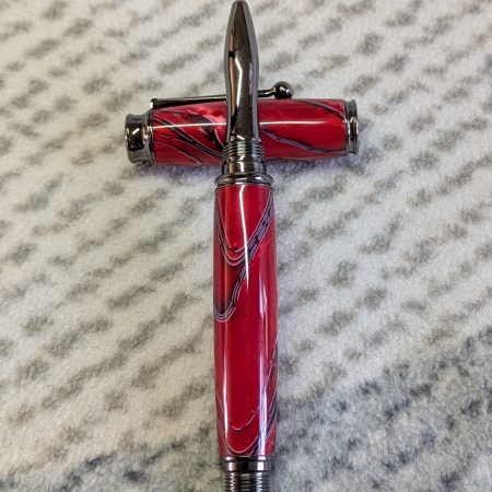 Acrylic omega style Rollerball Pen Made from red acrylic; with black and white lines