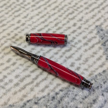 Acrylic omega style Rollerball Pen Made from red acrylic; with black and white lines