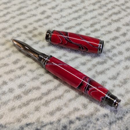 Acrylic omega style Rollerball Pen Made from red acrylic; with black and white lines