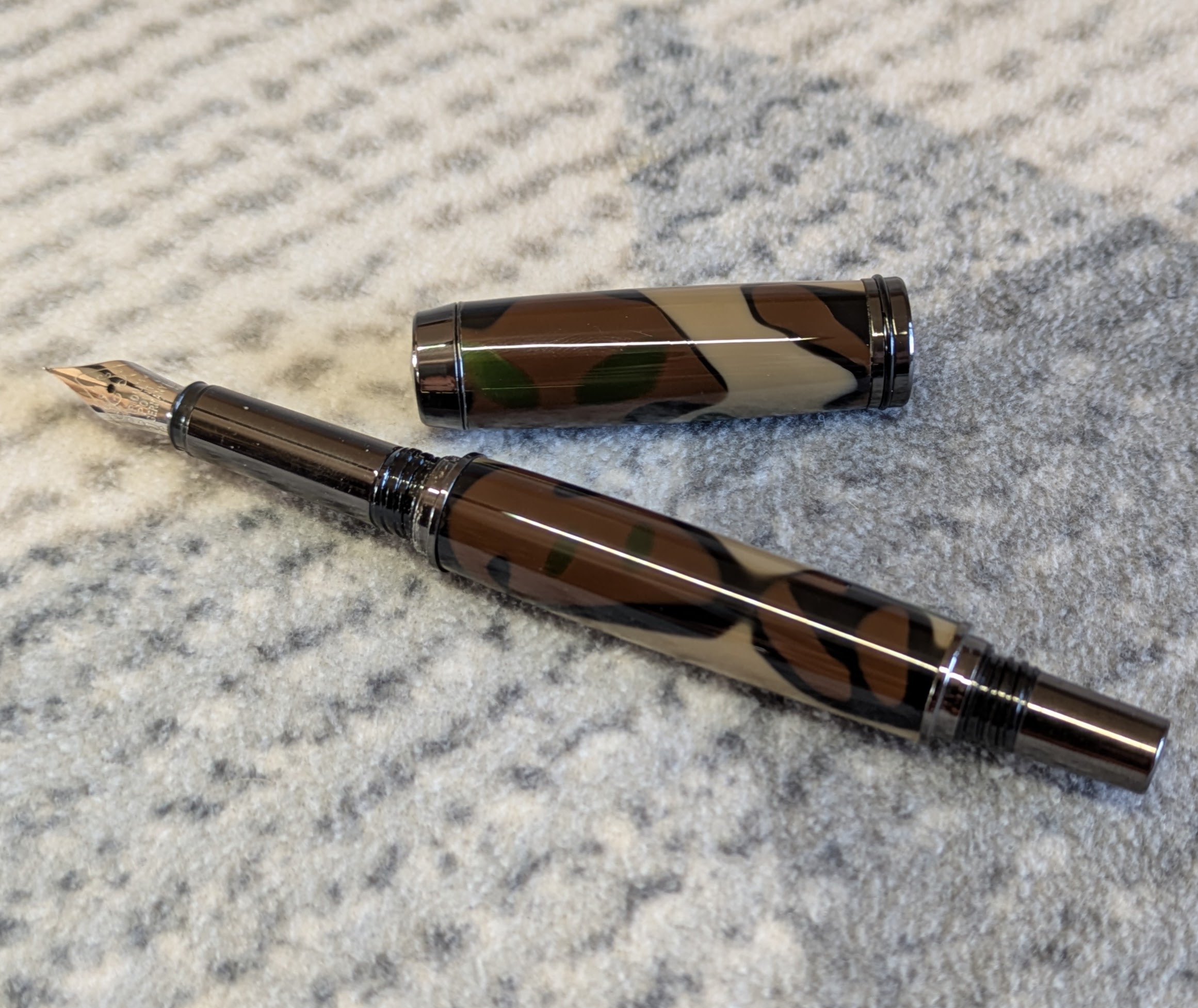 Acrylic Jr Gentleman-style fountain pen made from camouflage coloured acrylic with gun metal fitting