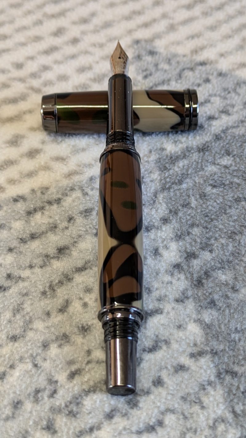 Acrylic Jr Gentleman-style fountain pen made from camouflage coloured acrylic with gun metal fitting