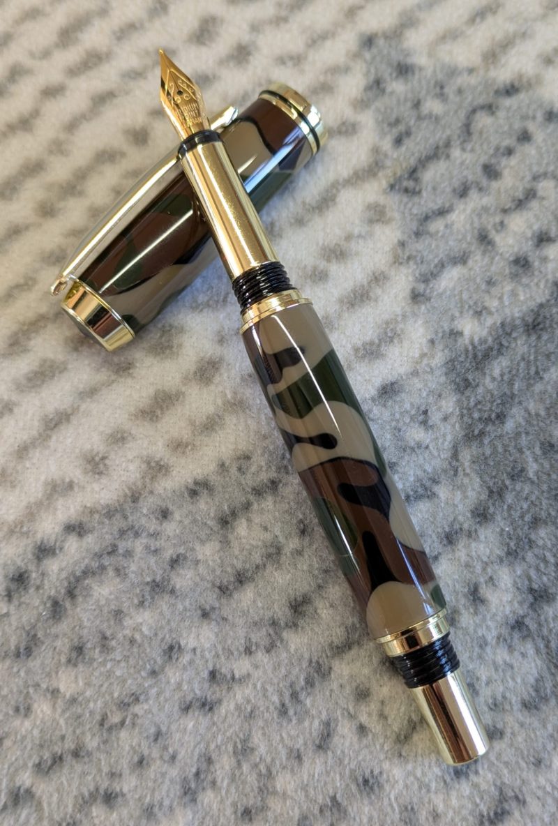 Acrylic Jr Gentleman-style fountain pen made from camouflage coloured acrylic with gold fittings