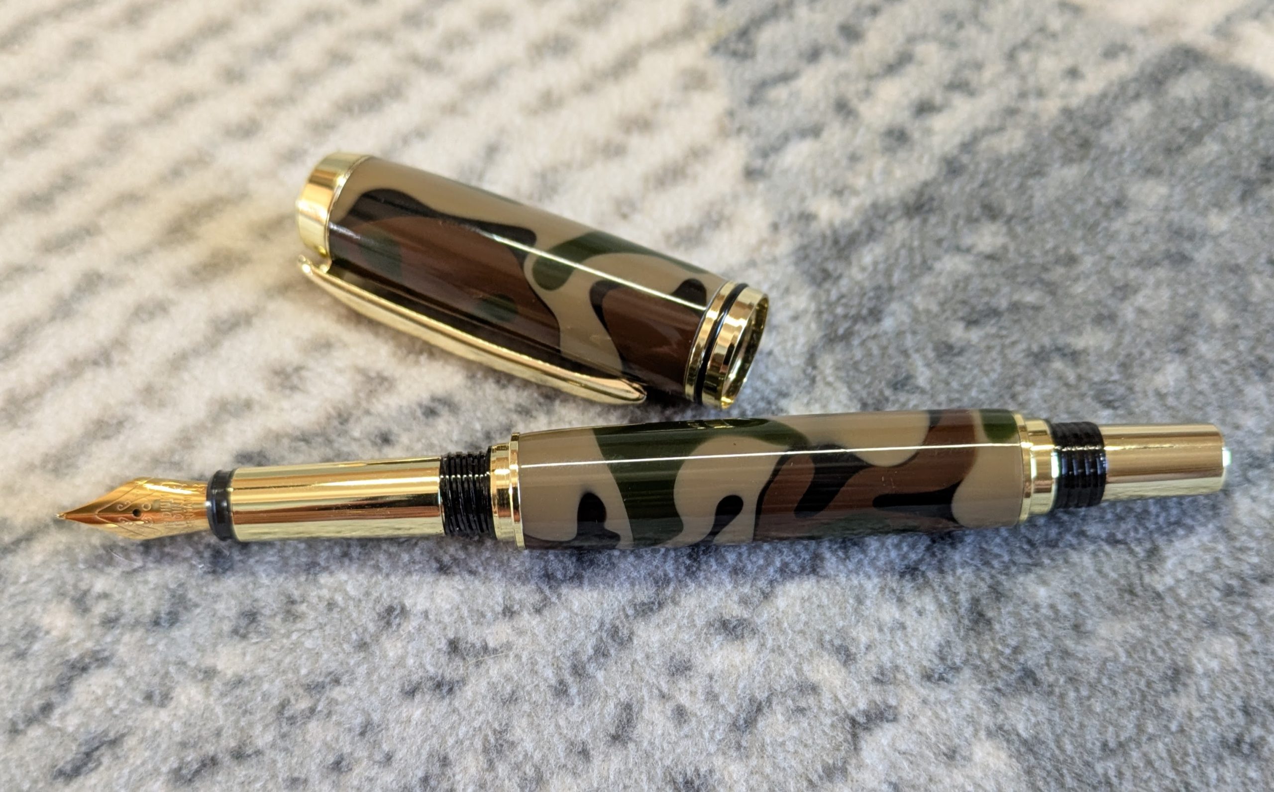 Acrylic Jr Gentleman-style fountain pen made from camouflage coloured acrylic with gold fittings
