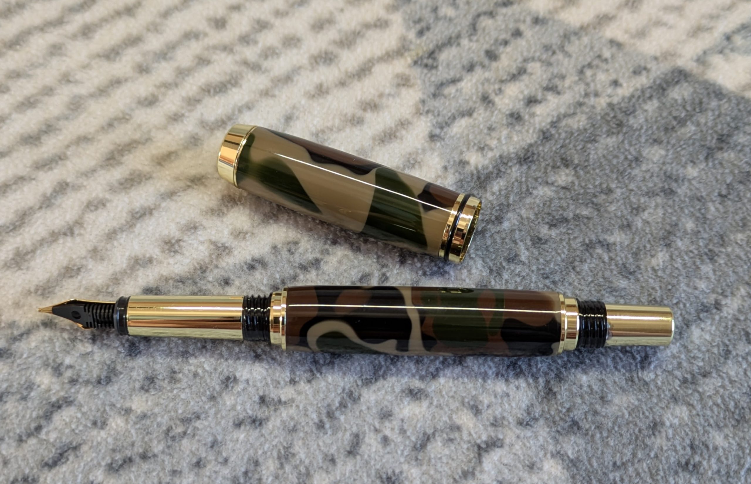Acrylic Jr Gentleman-style fountain pen made from camouflage coloured acrylic with gold fittings
