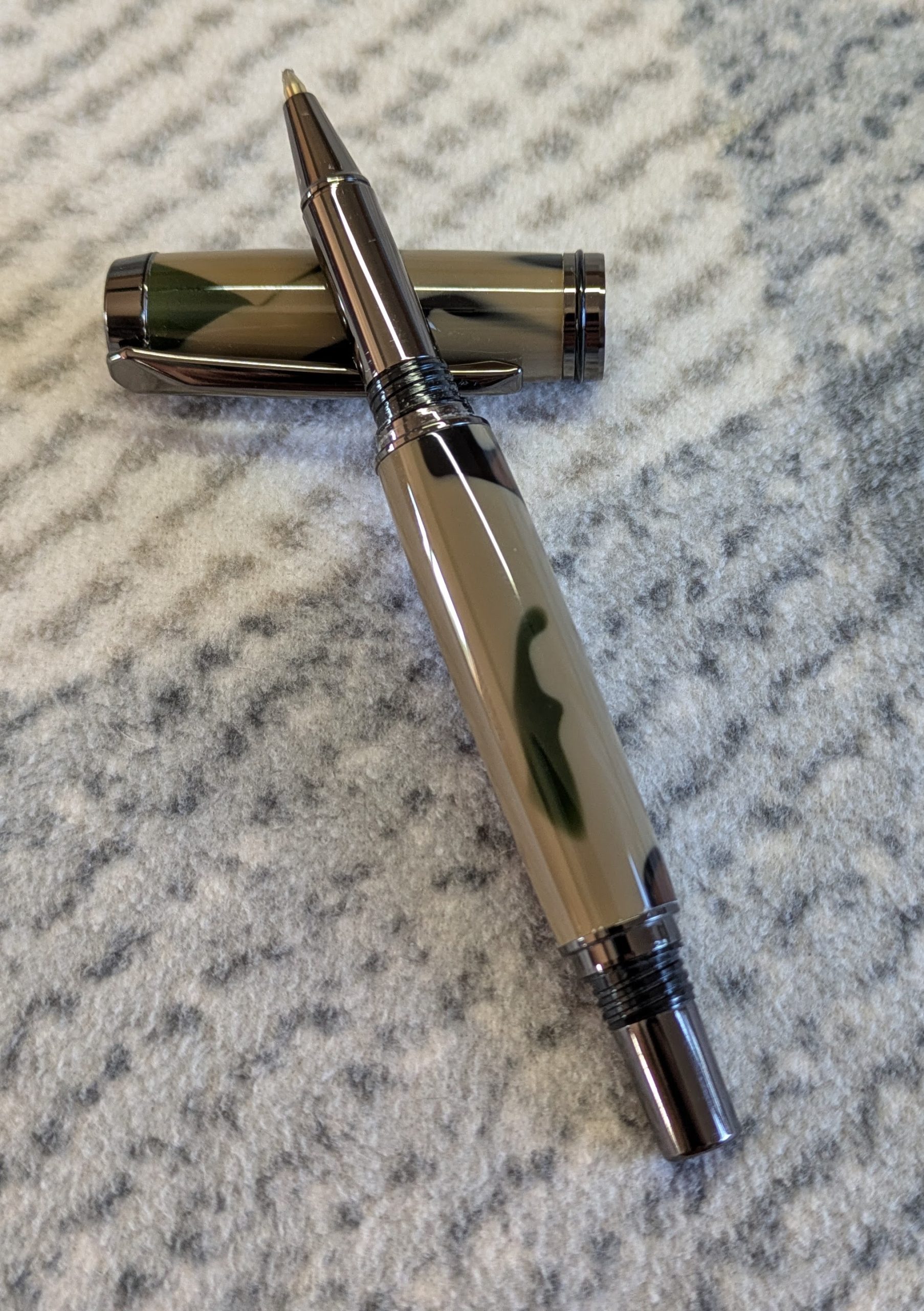 Jr Gentleman-style rollerball pen made from camouflage coloured acrylic with gun metal fitting