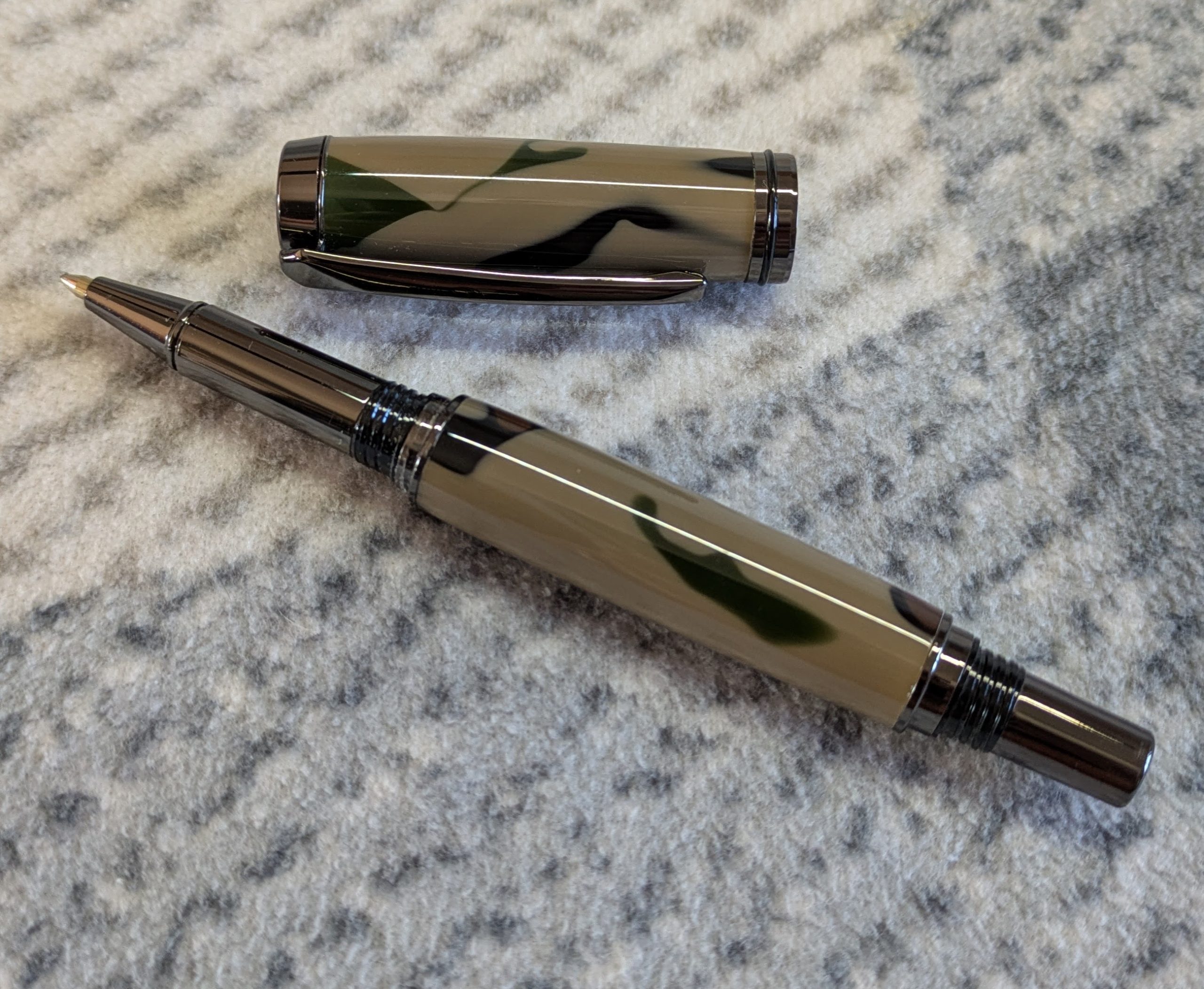 Jr Gentleman-style rollerball pen made from camouflage coloured acrylic with gun metal fitting