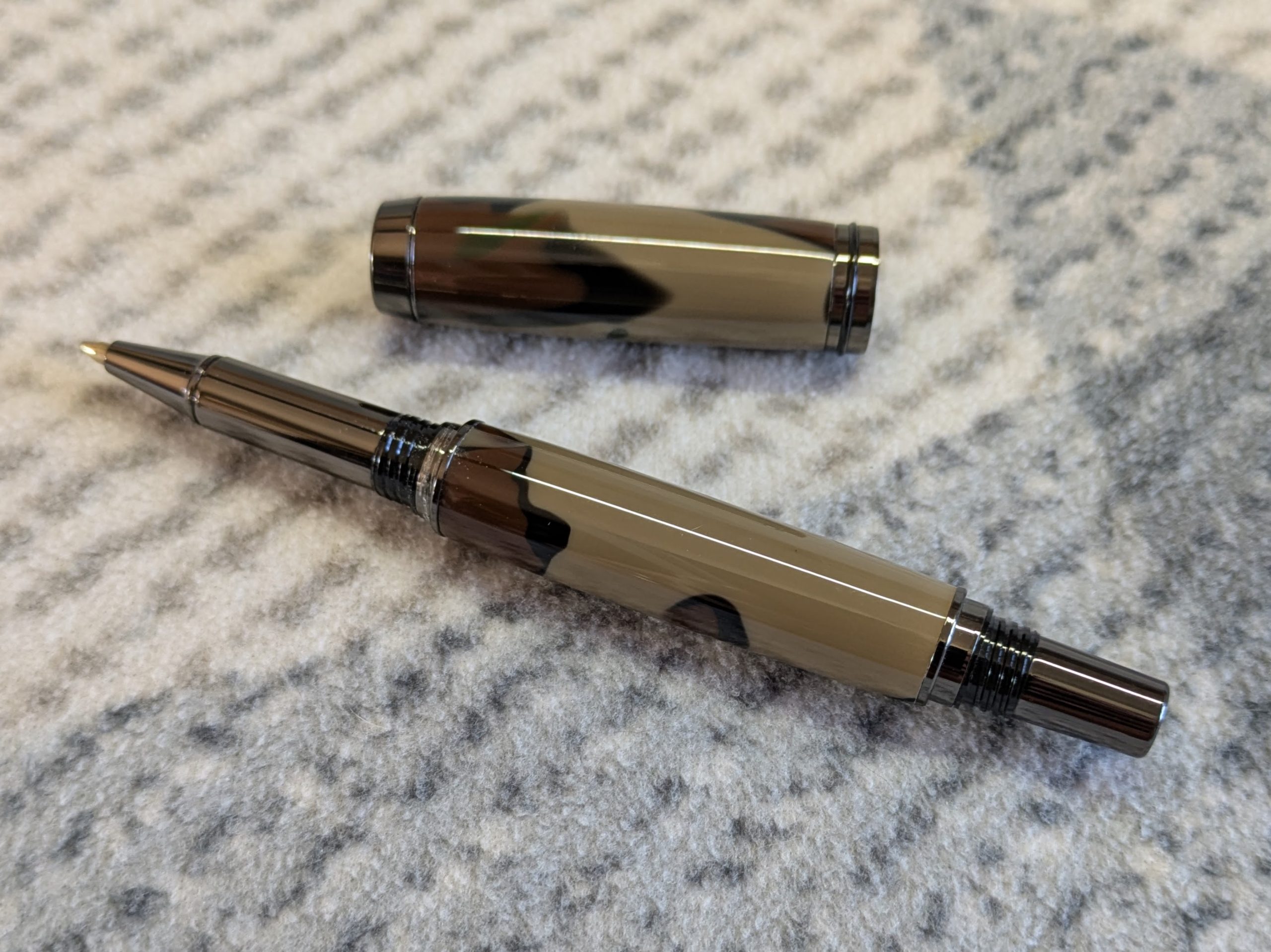 Jr Gentleman-style rollerball pen made from camouflage coloured acrylic with gun metal fitting