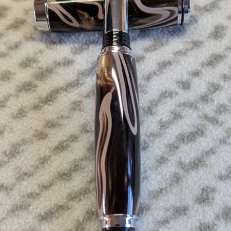 Jr Gentleman-style rollerball pen made from shimmering brown coloured acrylic with chrome fittings