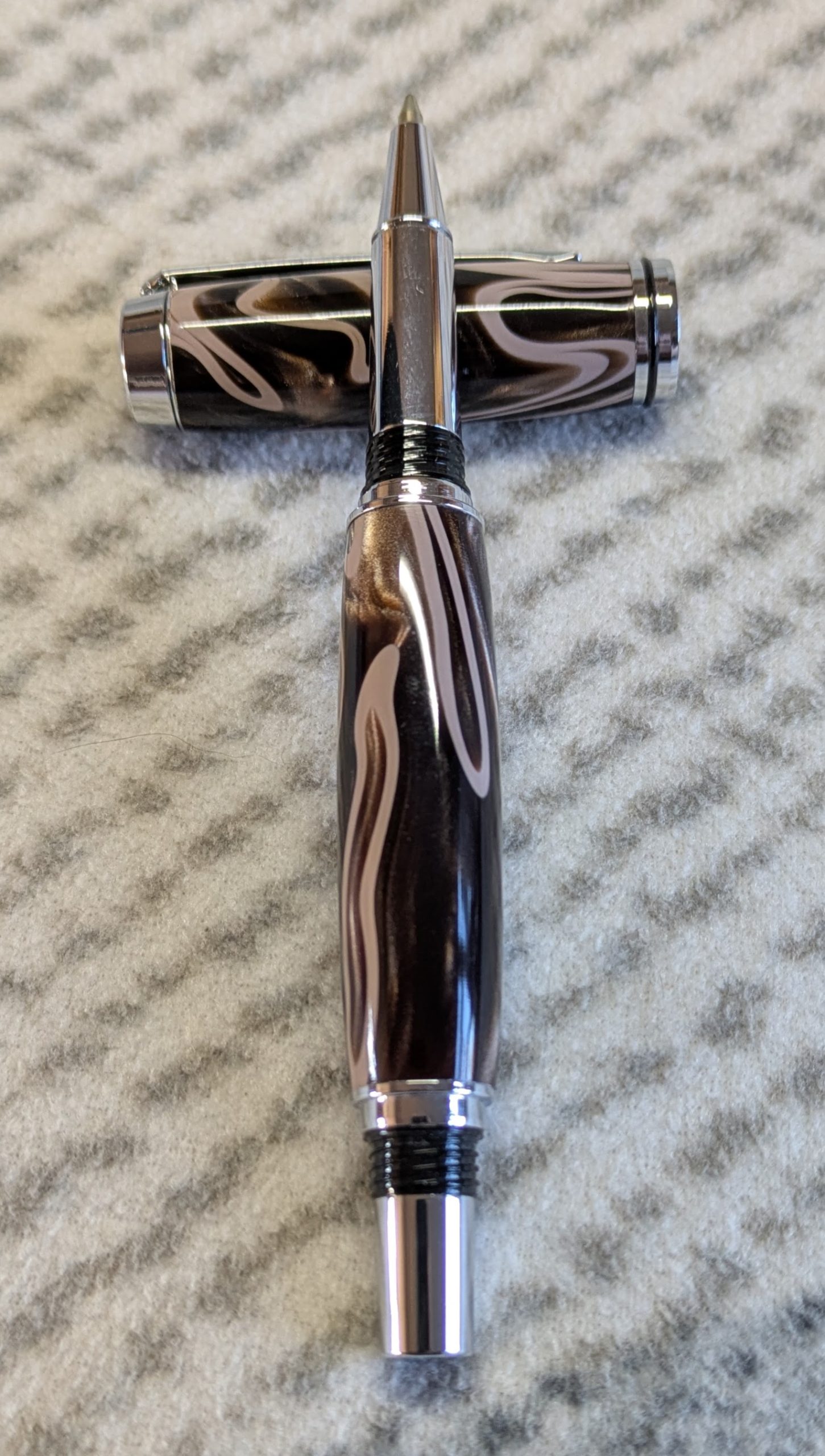 Jr Gentleman-style rollerball pen made from shimmering brown coloured acrylic with chrome fittings