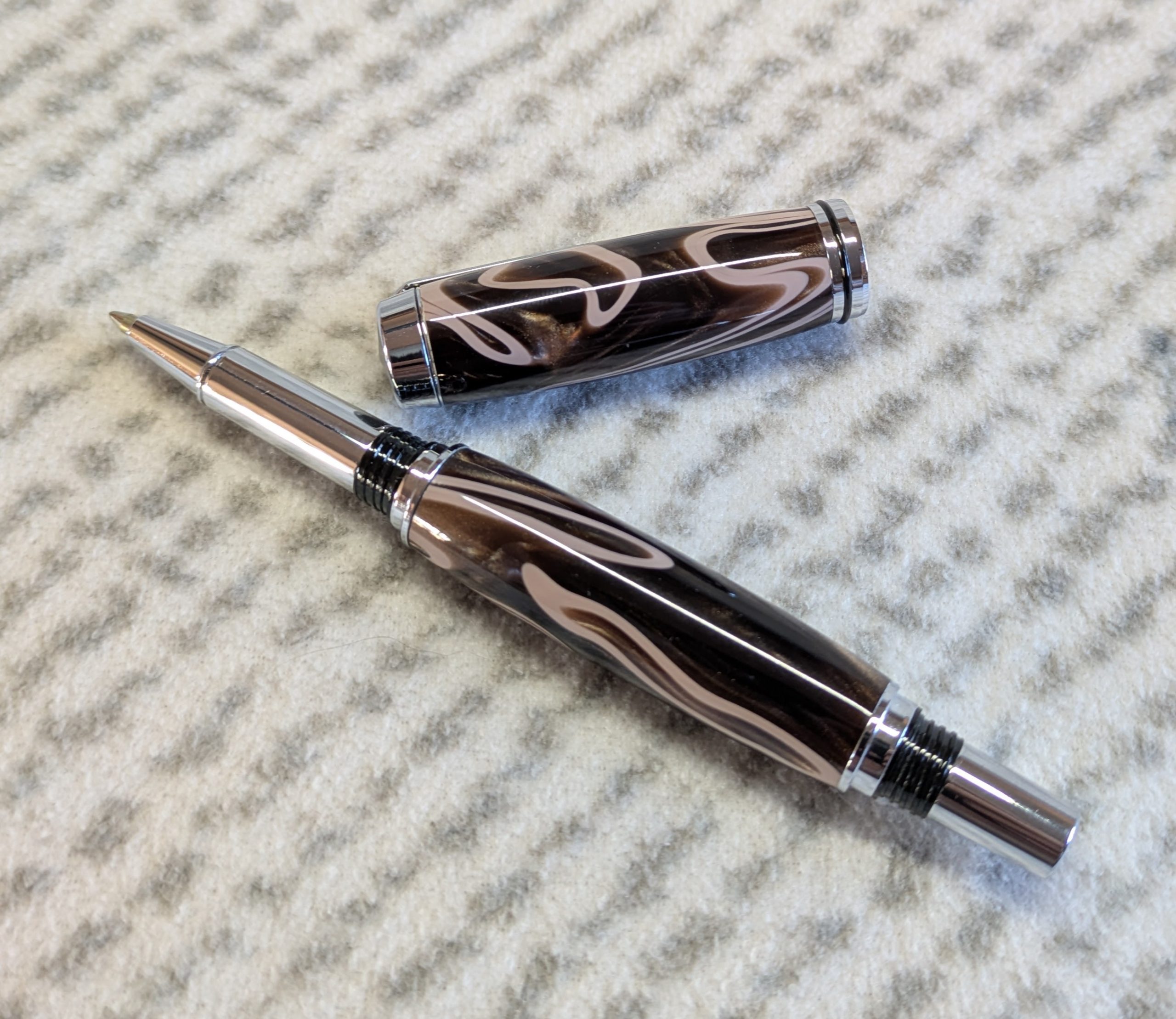 Jr Gentleman-style rollerball pen made from shimmering brown coloured acrylic with chrome fittings