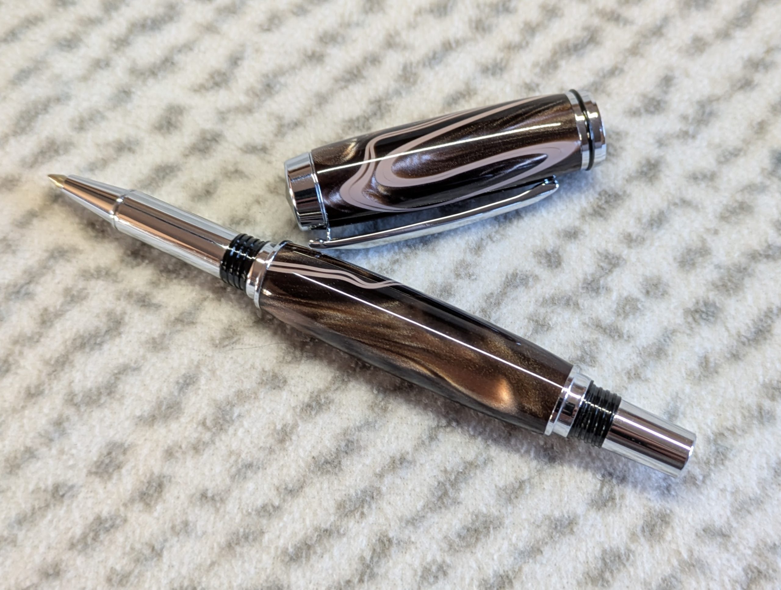 Jr Gentleman-style rollerball pen made from shimmering brown coloured acrylic with chrome fittings