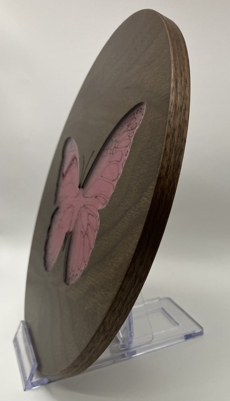 Gorgeous Circular Walnut Veneer Engraved with a Butterfly, filled with pink Resin