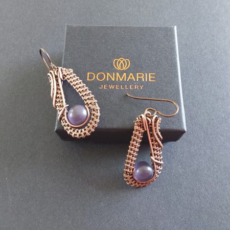 Dangly wire weave earrings with amethyst beads.